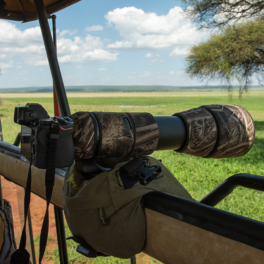 Wildlife photographer using a long lens during a Tanzania photographic safari