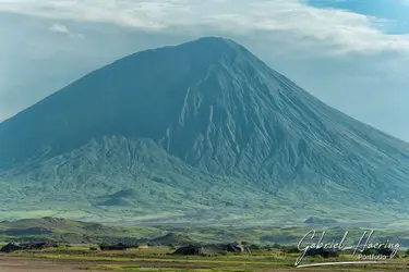 Ol Doinyo Lengai volcano seen from Lake Natron, Tanzania, photographed during a guided photographic safari.