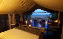 Evening view from a tented room at Katavi Wildlife Camp with private deck and wilderness atmosphere